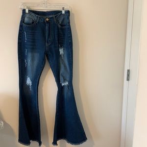 Long distressed bell bottom jeans